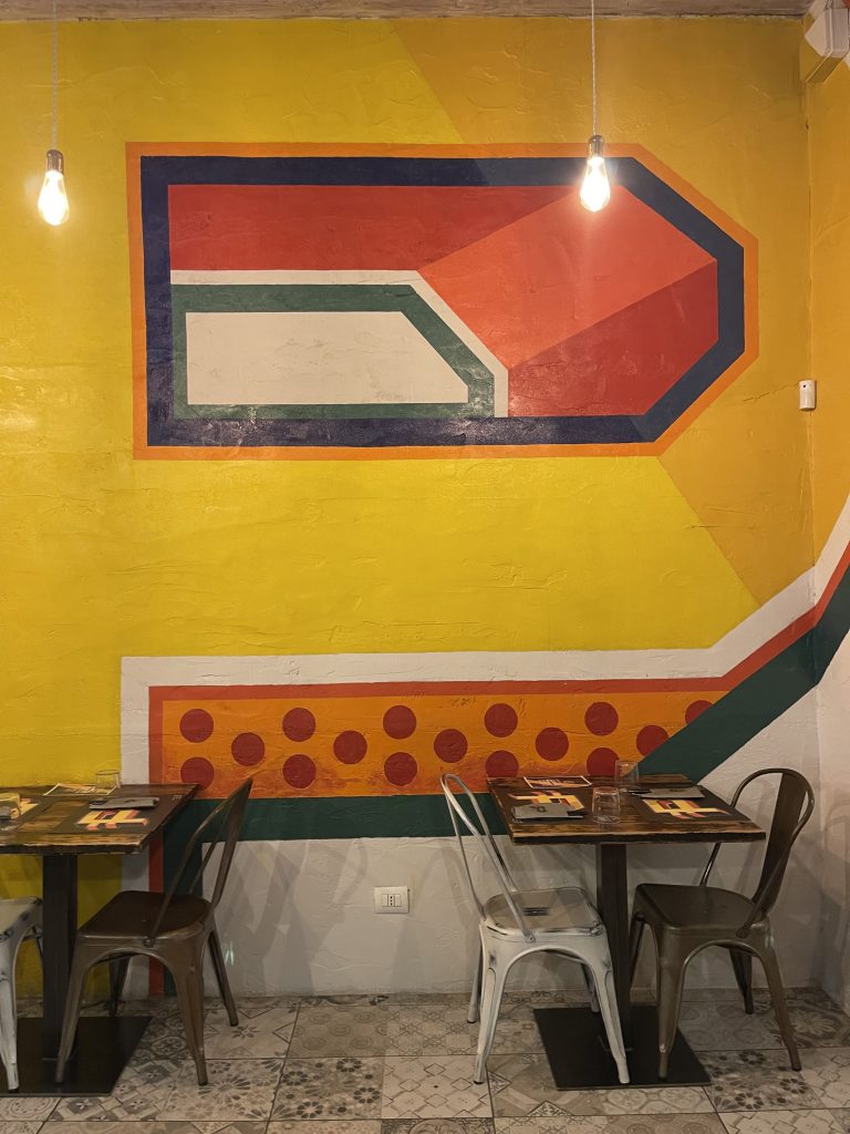 Grande P arancione, logo di Pizzeria P a Lissone
